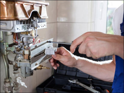 Plumber in Taunton servicing a boiler