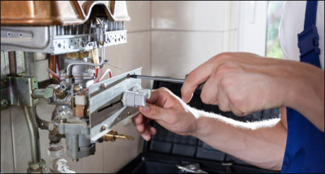 Plumber in Taunton servicing a boiler