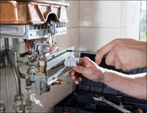 Plumber in Taunton servicing a boiler